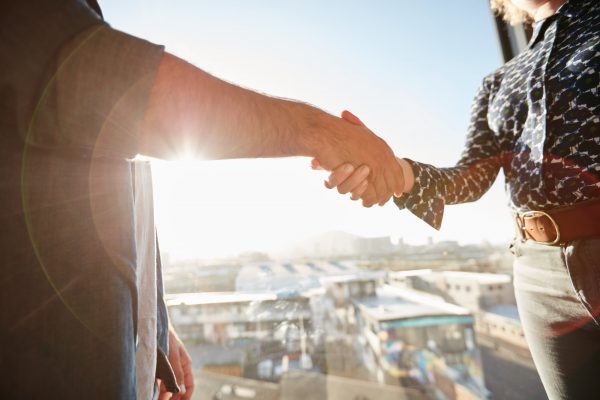 Handshake of two associates